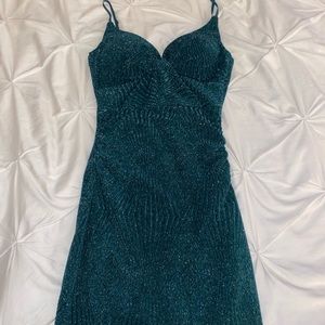 Emerald Green size S dress from Honey and Rosie bought at Dillards.